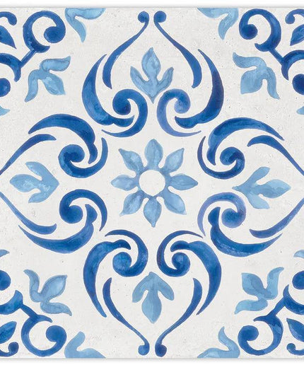 Decorative tile with blue floral and swirl pattern on a white background