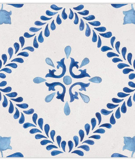 Decorative tile with blue floral pattern on a white background