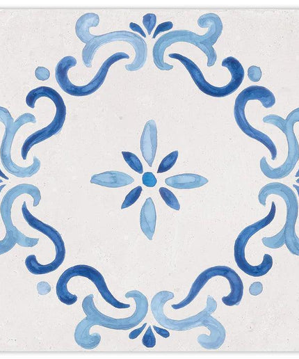 Decorative tile with blue floral and swirl patterns on a white background