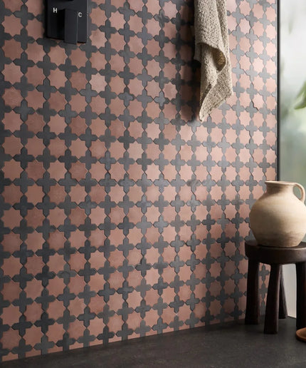 Alpana mara tiles single piece walls. Patterned wall with geometric design, small stool, and decorative items in a room setting.