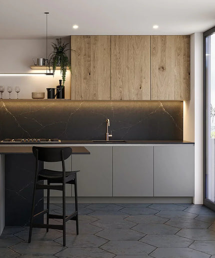 Modern kitchen with wooden cabinets, marble backsplash, and bar stools.