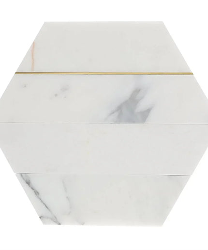 Hexagonal marble tile with a gold line on a white background