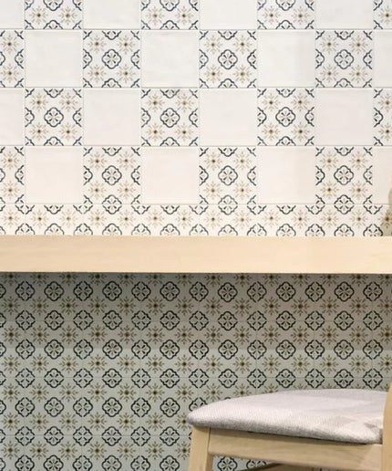 Patterned wallpaper with a wooden table and chair in the foreground