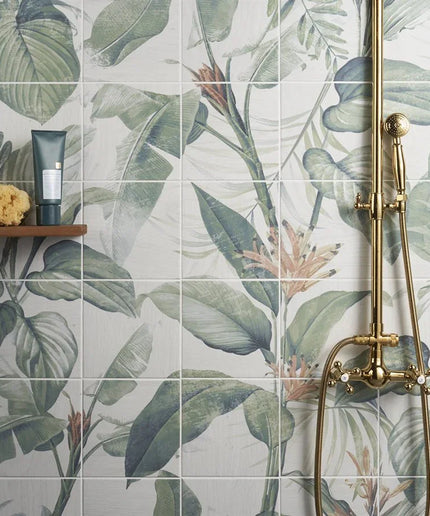 Bathroom with floral-patterned tiles and gold fixtures