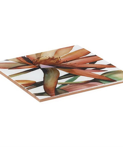 Square ceramic tile with a floral design on a white background