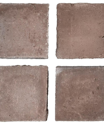 Four square tiles with a brown, textured surface on a white background