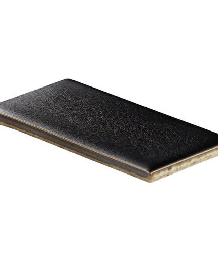 Black rectangular ceramic plate on a white background