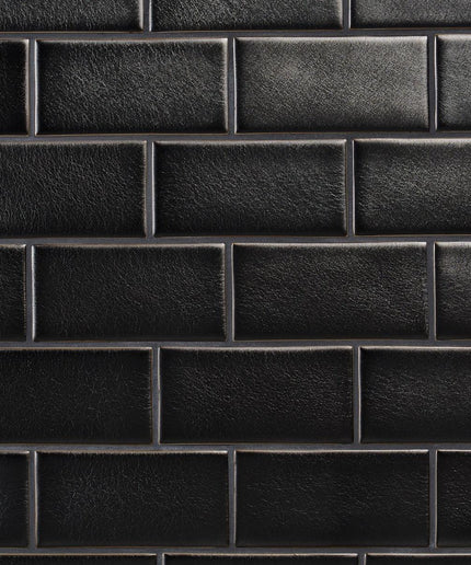 Close-up of a black leather texture with a grid pattern
