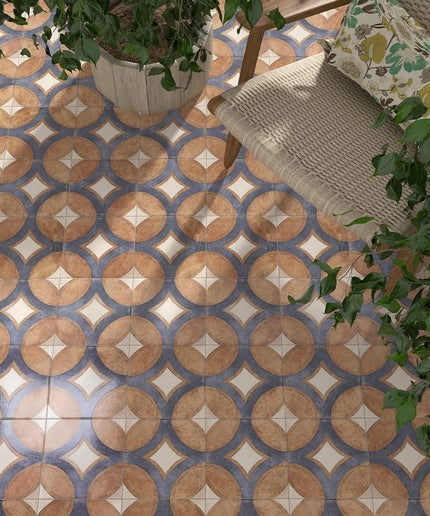 Patterned tile floor with a chair and plants