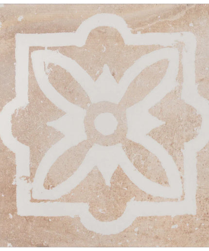 Decorative tile with a white floral design on a beige background