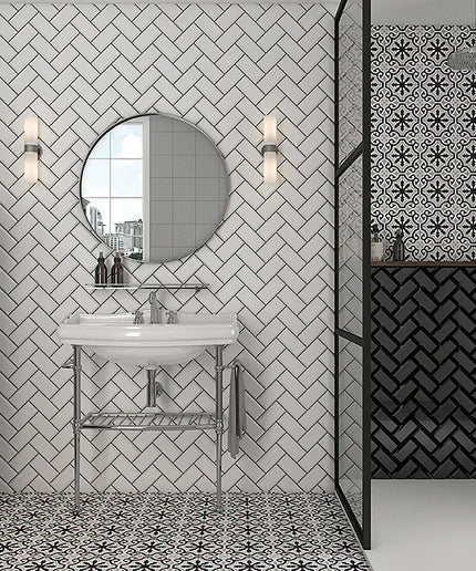 Modern bathroom with patterned tiles, sink, and decorative elements.