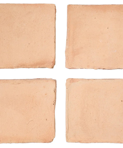 Four square crackers on a white background