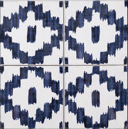 Four tiles with a blue and white abstract pattern