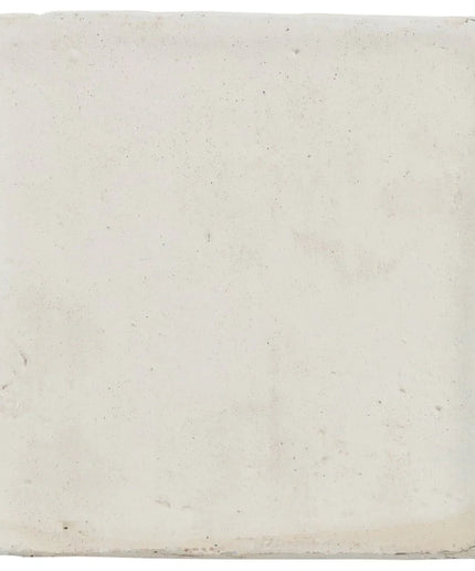 Square tile with a textured white surface