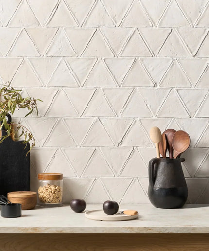 Kitchen counter with geometric tile pattern on the wall