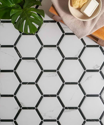 Hexagonal tile pattern with black grout lines on a white background