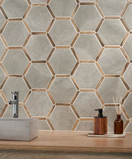 Bathroom with hexagonal tile pattern, sink, and decorative items.