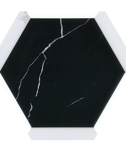 Hexagonal black marble tile with white veins on a white background