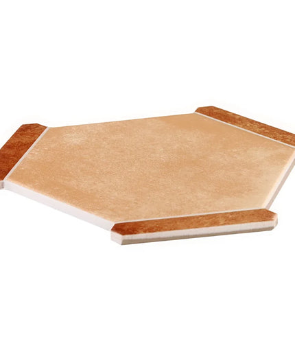 Hexagonal wooden cutting board with a white base on a white background