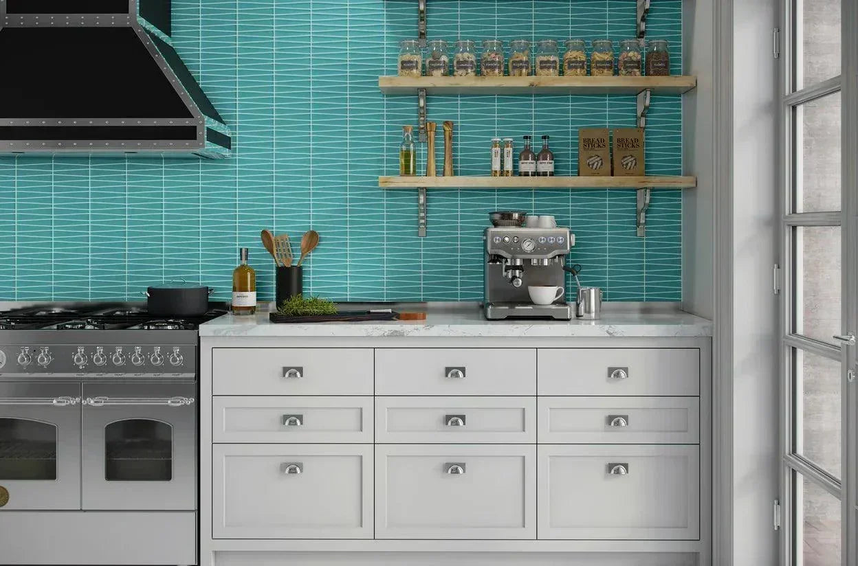 A modern kitchen backsplash featuring a wave-like pattern of Island Stone Waveline Glacier Gloss tiles.