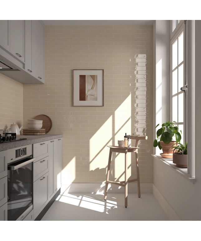 Modern kitchen with beige subway tile backsplash, natural light, and minimalist decor