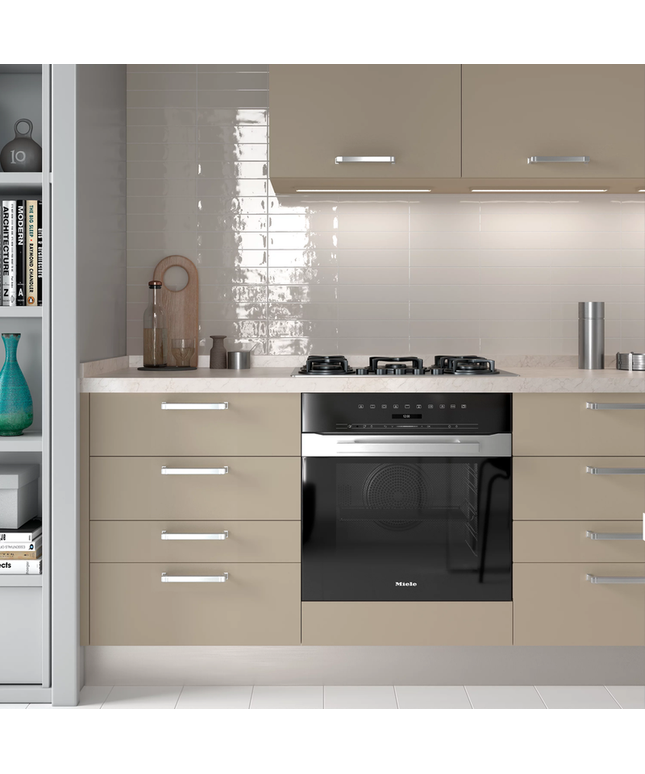 Glossy beige kitchen backsplash tiles behind stove and oven in modern kitchen design