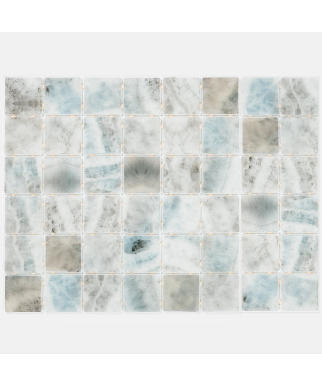 Marble mosaic tile pattern with gray and blue hues on a white background