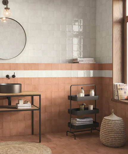 Modern bathroom interior with a sink, mirror, and window.