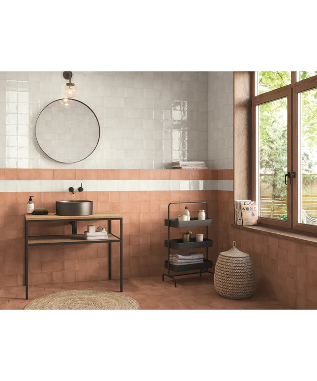 Modern bathroom interior with a sink, mirror, and window.