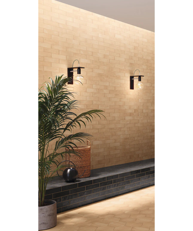 Modern wall lights on a beige tiled wall with a plant and decorative basket.