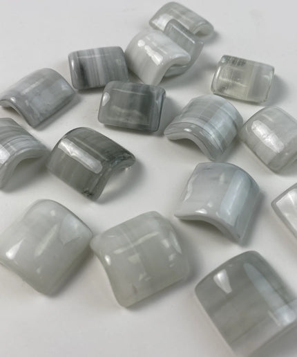 Glossy gray and white curved mosaic glass tile pieces for backsplash or bathroom decor