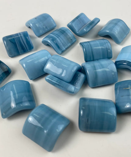 Glossy blue curved mosaic tiles with subtle stripe pattern, ideal for backsplash or bathroom decor