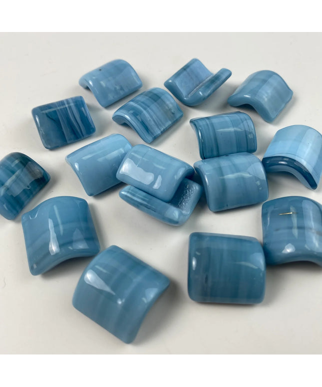 Glossy blue curved mosaic tiles with subtle stripe pattern, ideal for backsplash or bathroom decor