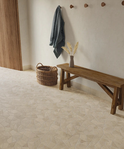 Wooden bench and hooks against a wall with a textured floor.
