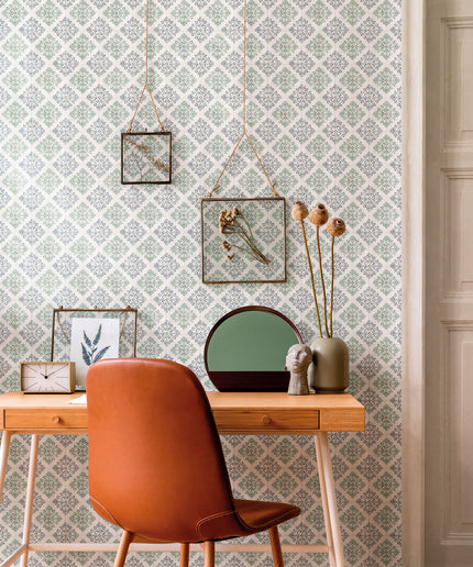 Patterned tile accent wall in modern home office with wooden desk and leather chair