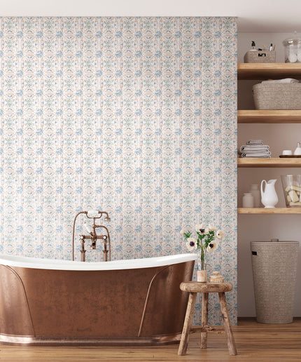 Elegant bathroom with patterned tile wall, freestanding copper bathtub, and wood shelving
