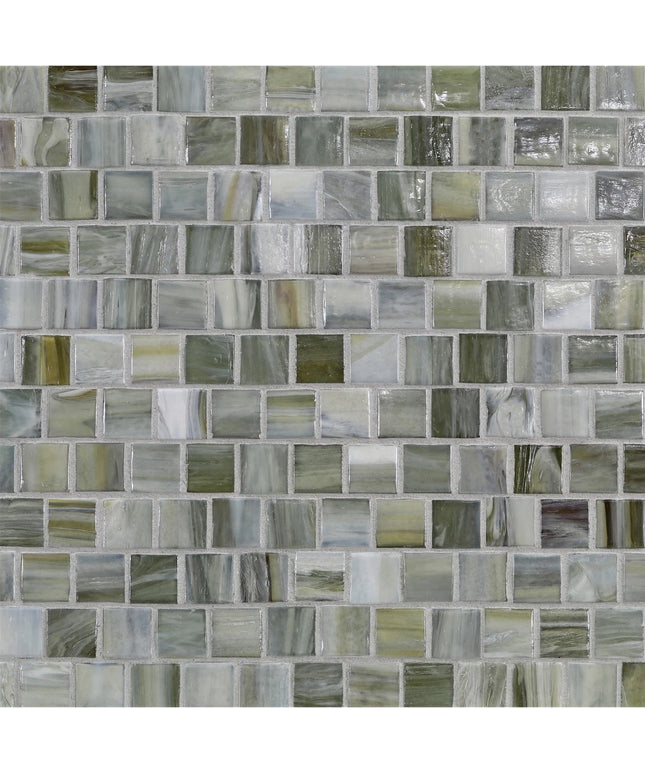 Pattern of small square tiles in various shades of gray and green.