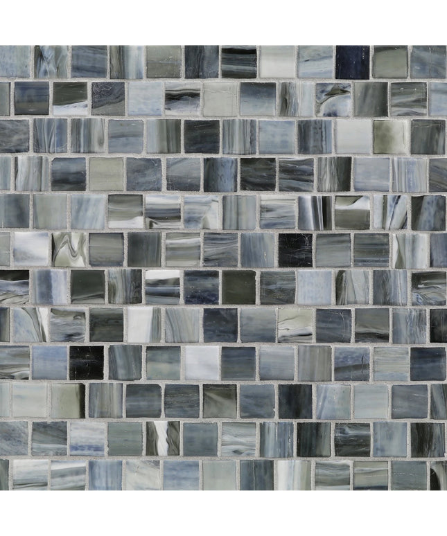 Pattern of small square tiles in various shades of gray and blue.