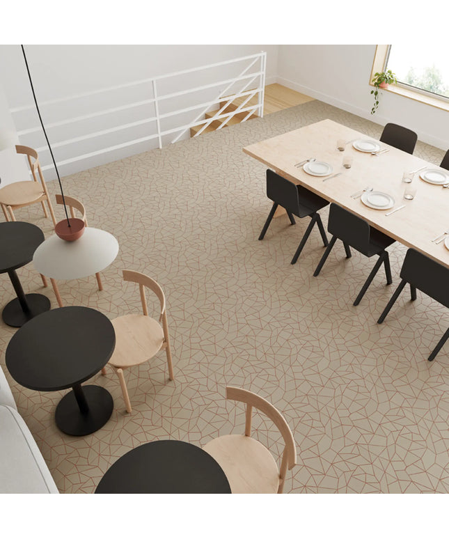 Modern dining area with tables, chairs, and a patterned floor.
