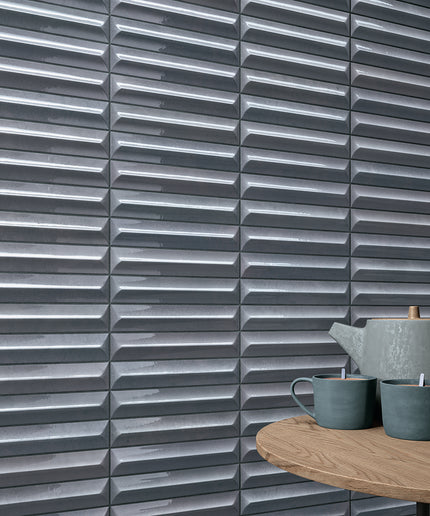 Storm blue 3D textured tile backsplash with ceramic teapot and mugs on wooden table