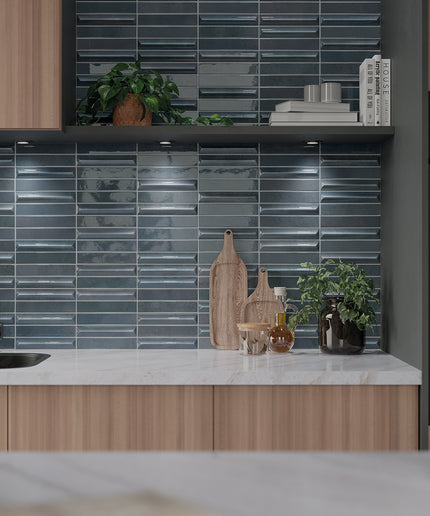 Glossy storm blue tile kitchen backsplash with wood cabinets and marble countertop
