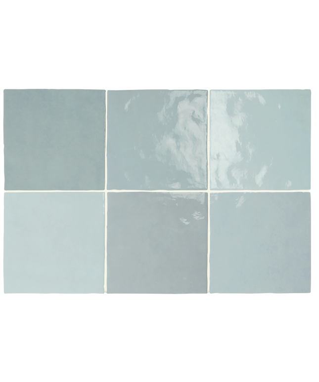 Six square ceramic tiles arranged in a 2x3 grid, showcasing different glaze finishes and colors in a dusty light blue, sage green, and pale gray-blue palette.