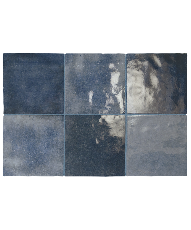 Six square ceramic tiles arranged in a 2x3 grid, showcasing various shades of textured and glossy navy blue, slate blue, and gray with reflective highlights.