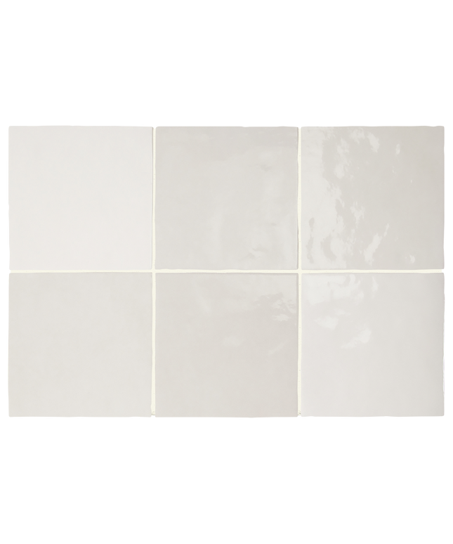 Six square ceramic tiles arranged in a 2x3 grid, showcasing different glaze finishes and colors ranging from matte off-white to glossy cream and light gray.
