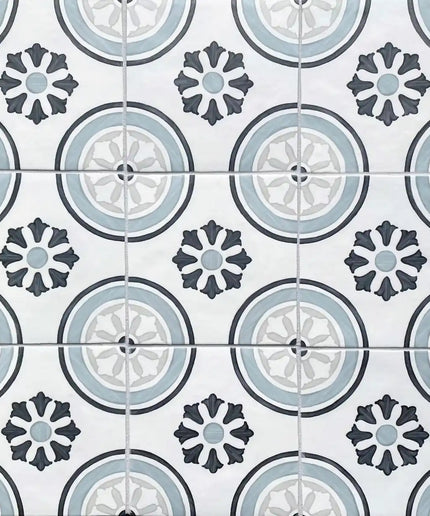 Patterned ceramic tiles with blue, grey, and white geometric and floral designs