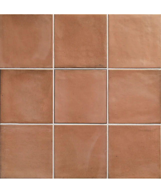 Grid of terracotta tiles with a warm brown color.