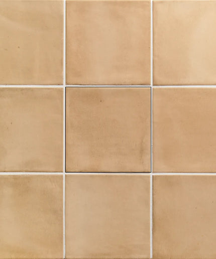 Grid of beige tiles with a subtle pattern