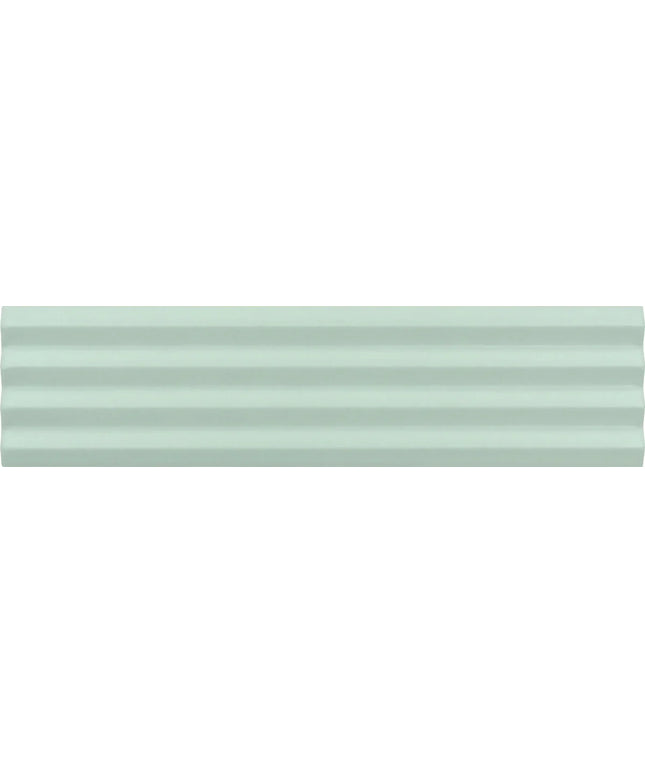 A close-up of a pale mint green textured surface with subtle horizontal ridges.