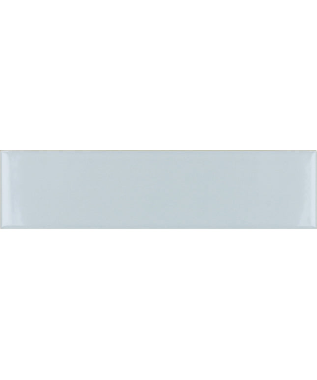A glossy rectangular ceramic subway tile in a very light cool gray with a subtle white sheen.