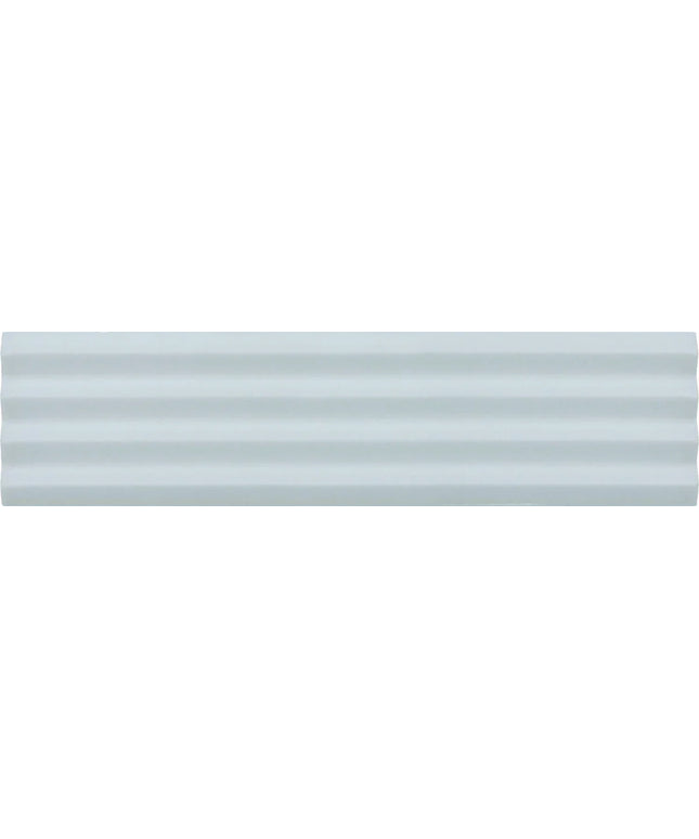 A close-up of a light gray ribbed or wavy textured surface, likely a material or finish swatch.